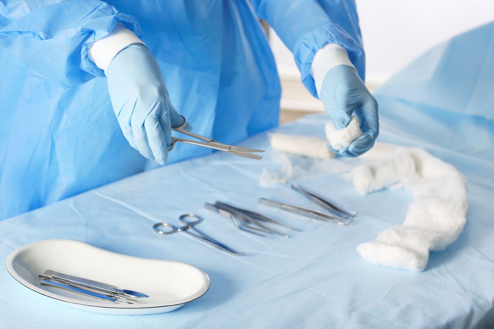 surgeon with tools on table